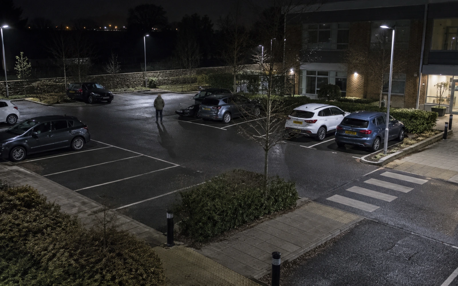 An elevated view across a managed office car park.